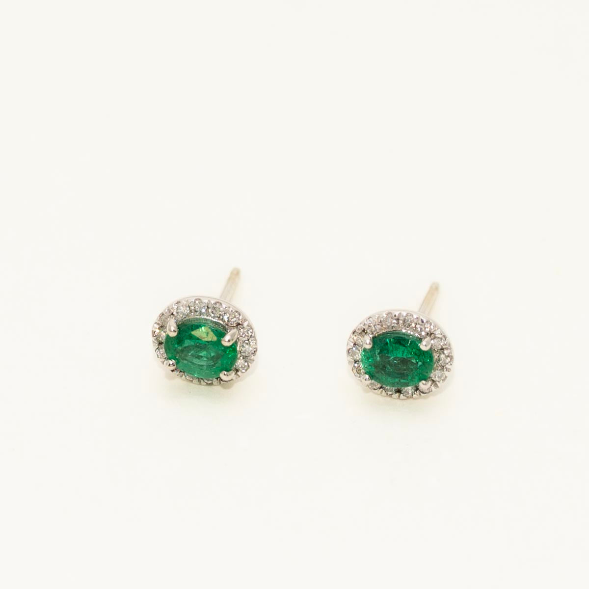 Oval Emerald Halo Stud Earrings in 14kt White Gold with Diamonds (1/7ct tw)