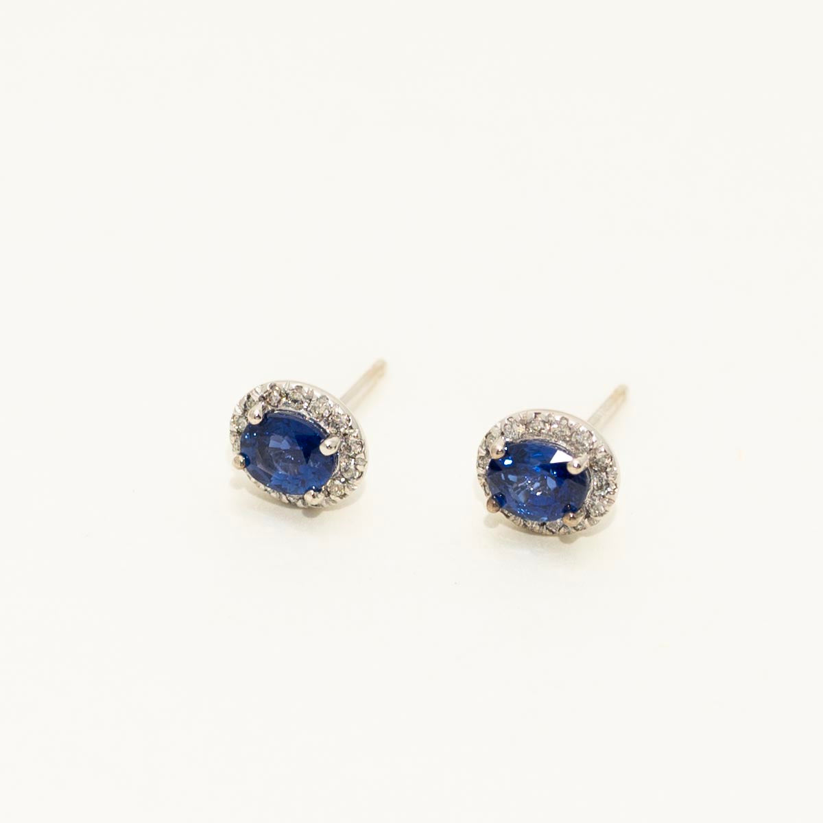 Oval Sapphire Halo Stud Earrings in 14kt White Gold with Diamonds (1/7ct tw)